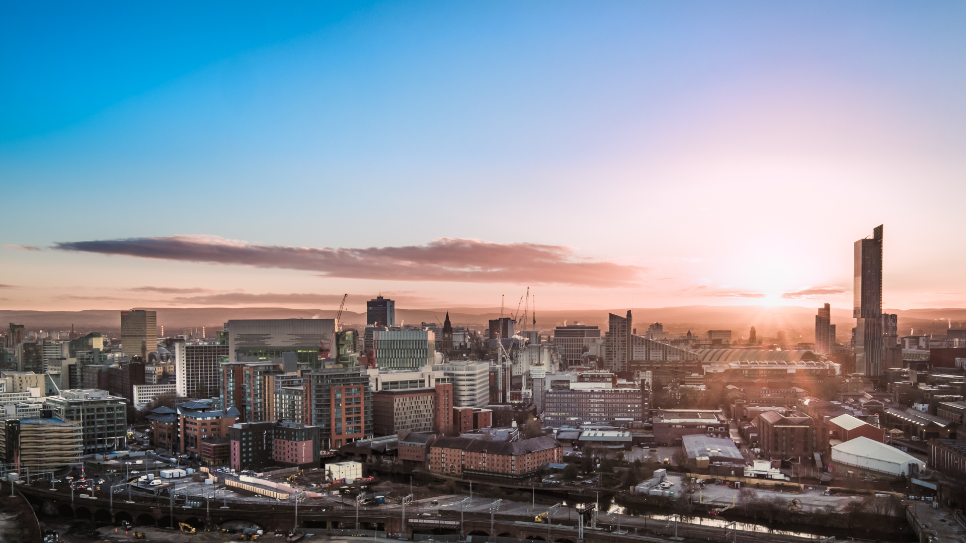 Manchester cityscape at dusk, our operating territory